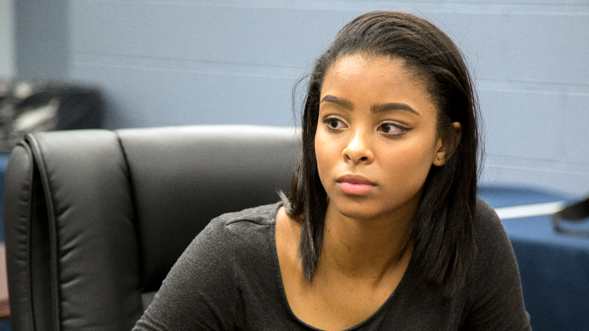 Brooke Gist, an 11th grade student at Whitney M. Young High School, speaking with classmates, alumni, and WBEZ host Jenn White. (Andrew Gill, WBEZ).