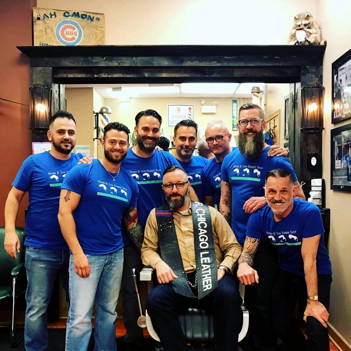 Jerry Cernak (seated) poses for a photo with the staff at Father and Son barbershop. Cernak won the Mr. Chicago Leather competition in 2017. (Photo courtesy of Jerry Cernak.)