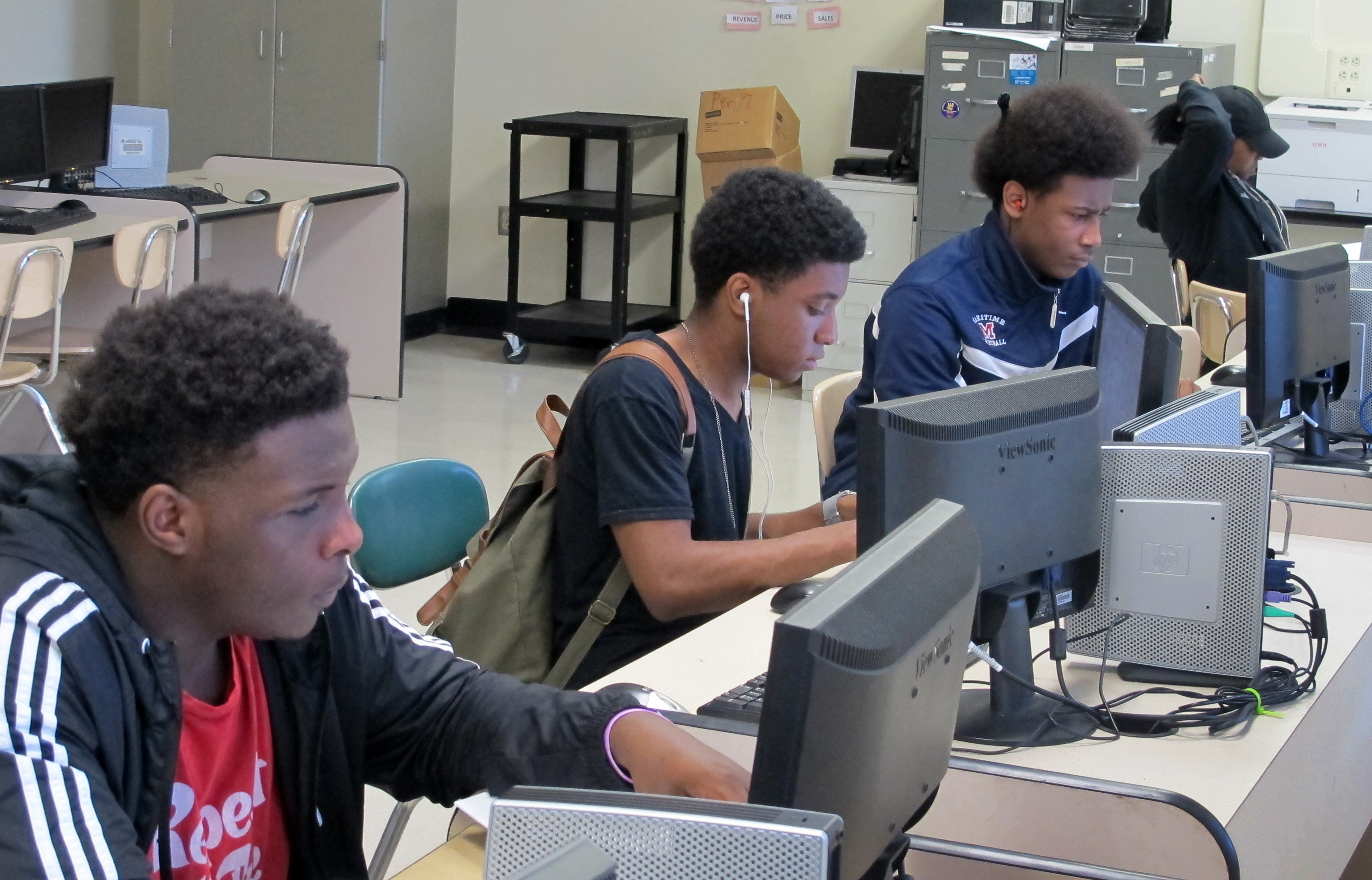 Students work at computers inside Bennett High School in Buffalo, N.Y in May 2016. The high school is being redesigned with a focus on specialty programming, such as computer science or solar energy, in order to position students to land well-paying jobs being created amid a surge in economic development in the city. (AP Photo/Carolyn Thompson).