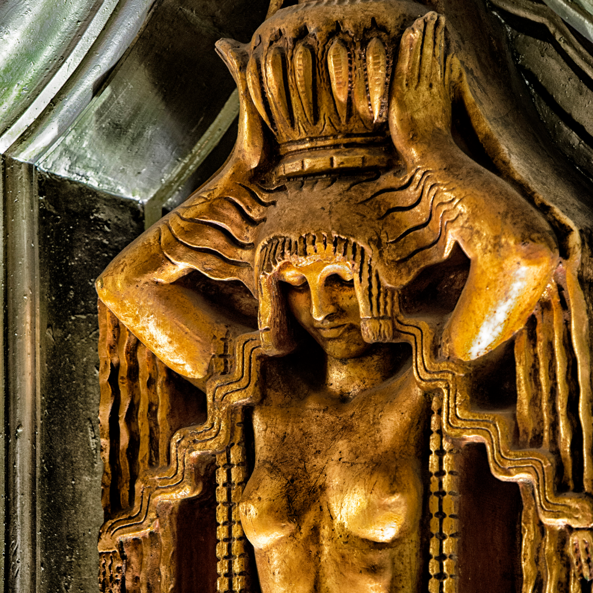 The interior lobby is almost as ornate as the outer lobby. This carving is approximately 5 feet high. She and several of her sisters are carved 20 feet above the floor in the interior lobby, along with other ornate pieces. (Jason Marck/WBEZ)