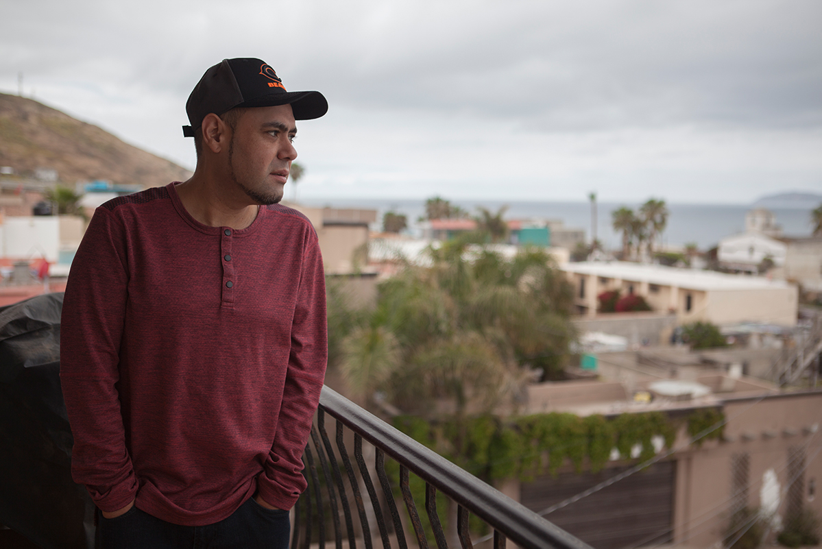 Miguel Pérez looks out over Tijuana from his balcony.